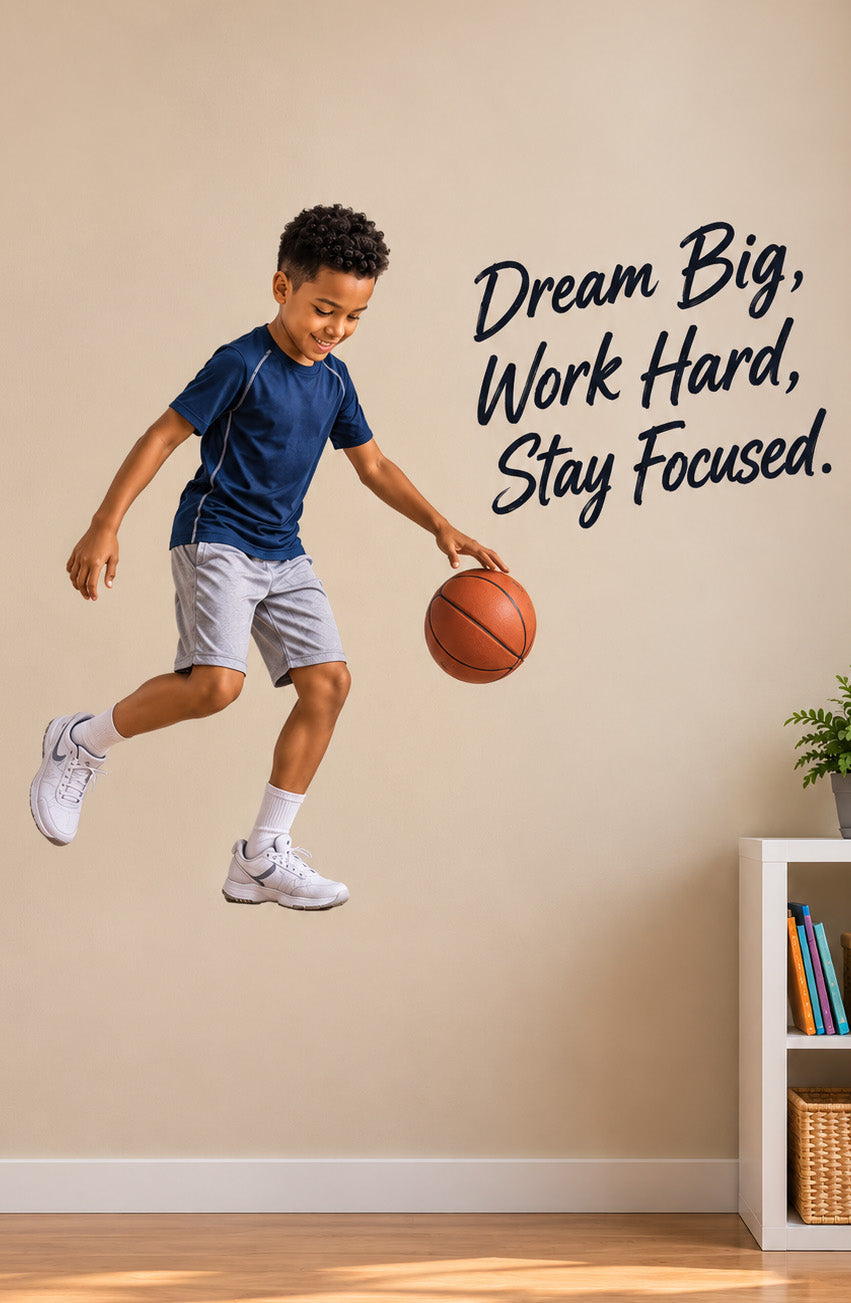 Custom basketball wall sticker featuring a boy jumping with a basketball and the motivational words “Dream big, Work Hard, Stay Focused” in a sports-themed bedroom.